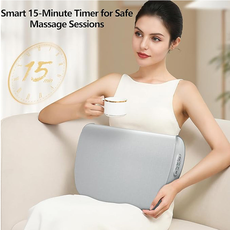 Woman on a sofa with the Heated Kneading Massage Pillow behind her back